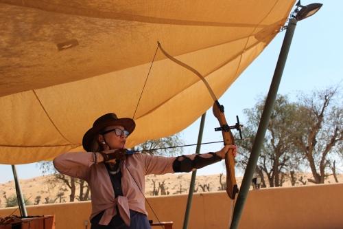 Sophie Neville shooting with a compound bow in the Emirates 2016.