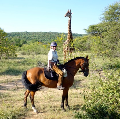 TWT Ride 2018 Sophie Neville with giraffe at Ant's Nest - photo Ant Baber